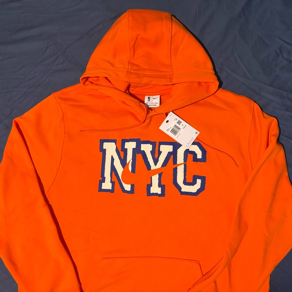 Nike Men’s Orange NYC Pullover Hoodie with Blue-Trim Logo
